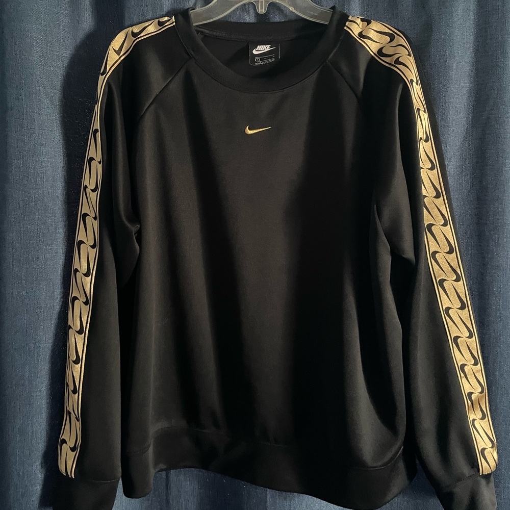 Women’s Large Nike crew neck pullover- Black with gold swoosh down each sleeve.